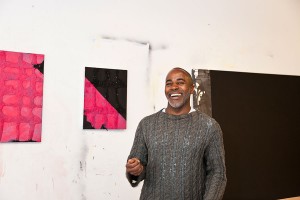 Photo of Arnold Kemp with his artwork