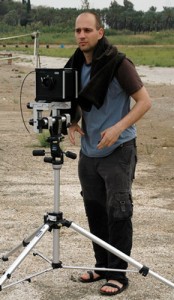 Photo of Oded Hirsch outdoors with camera